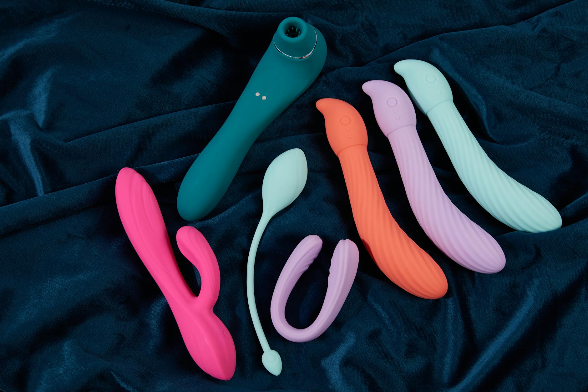 Hand holding a blue lemon vibrator demonstrating precise placement