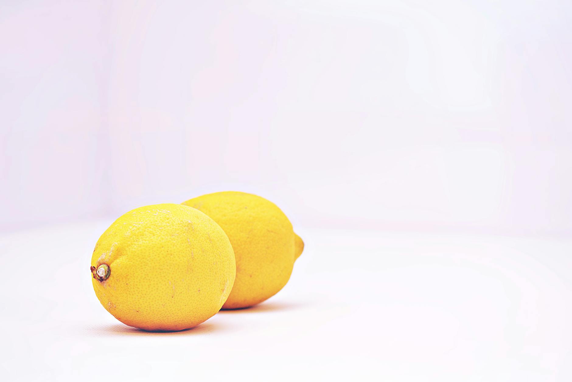 Hands holding pastel-colored silicone toys with gentle touch